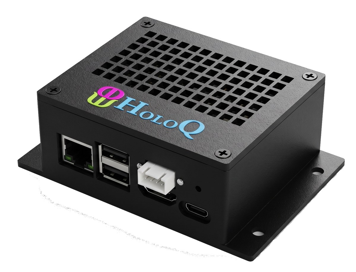 HoloQ Player in its optional black metal enclosure, shown from an angle with vented top, mounting flanges, and front ports